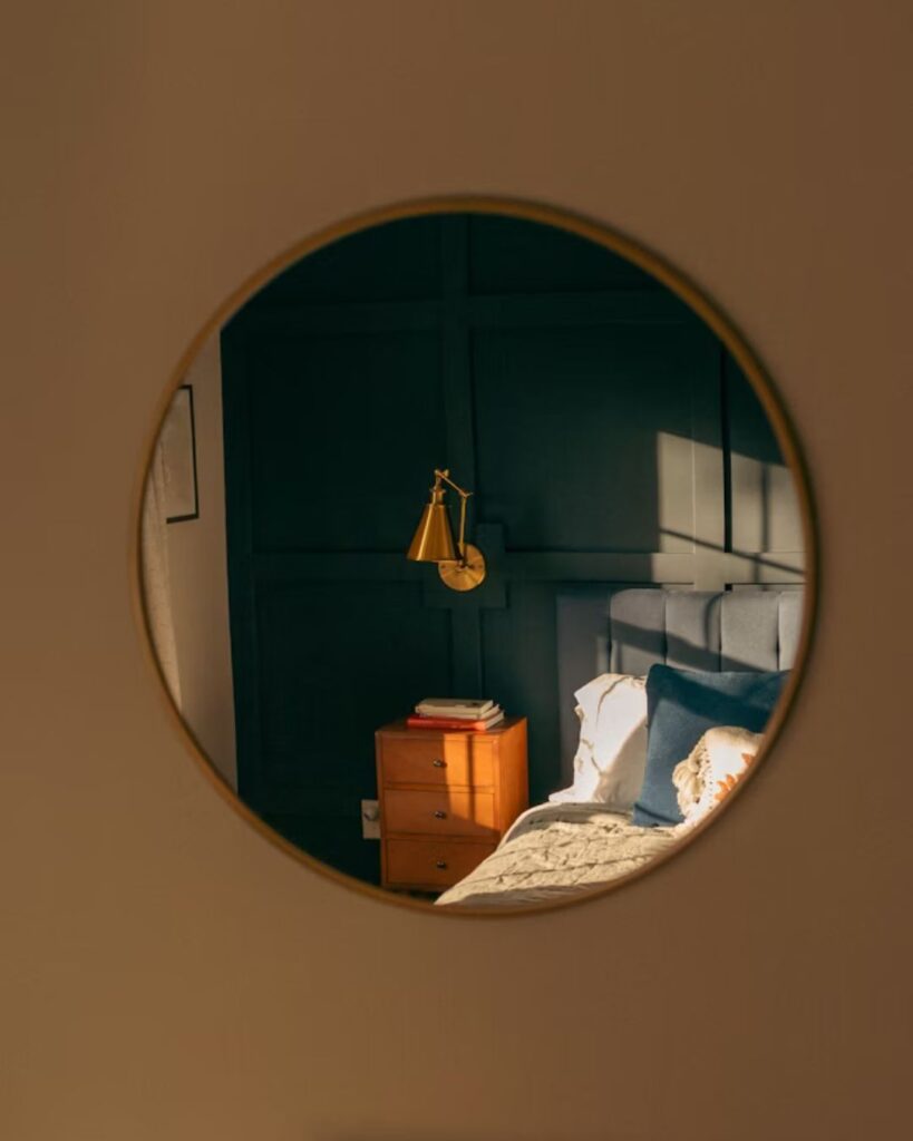 Minimal mirror decor in a cozy small apartment bedroom