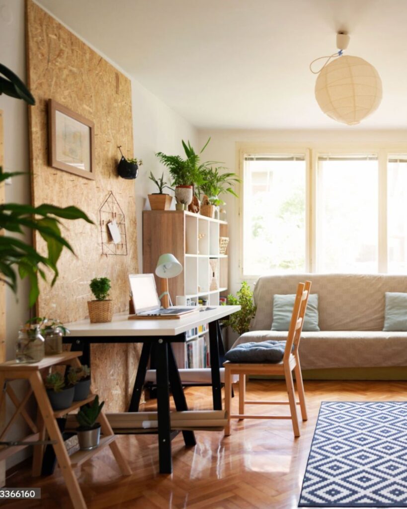 Small living room with compact desk and vertical storage