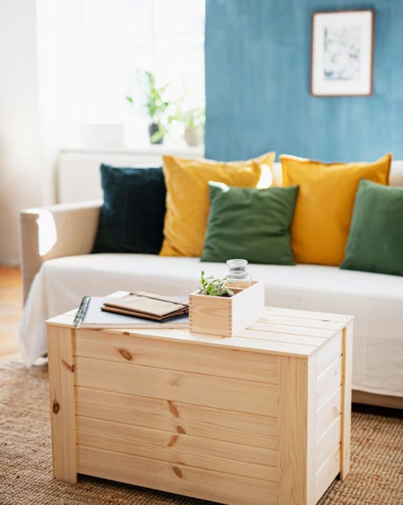 Woven storage baskets in small living room for organizing blankets